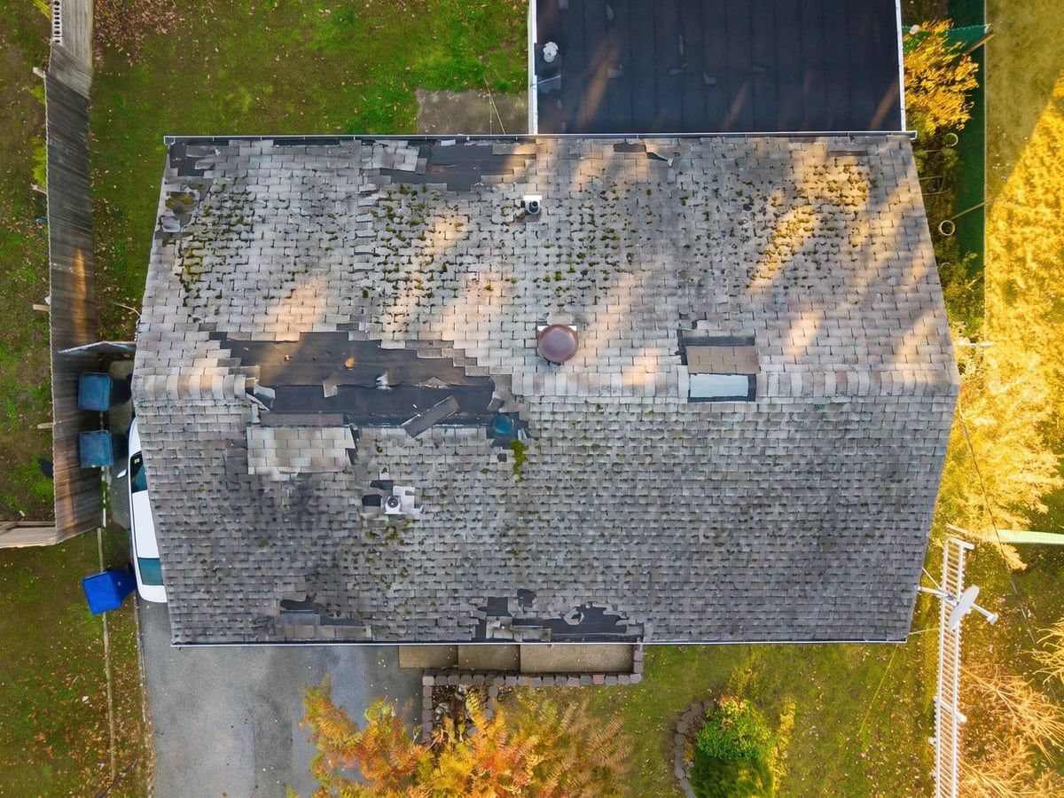 Aerial view of completed shingle roof — before